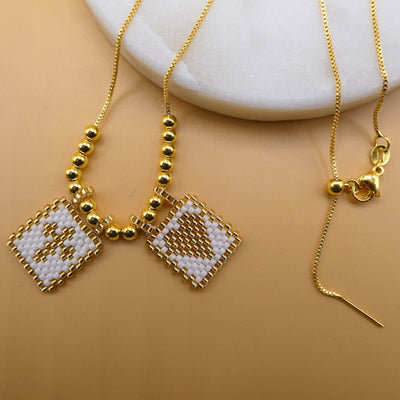 Gold-Plated White Miyuki Necklace with Cross and Heart Charms - Guadalupe Gifts